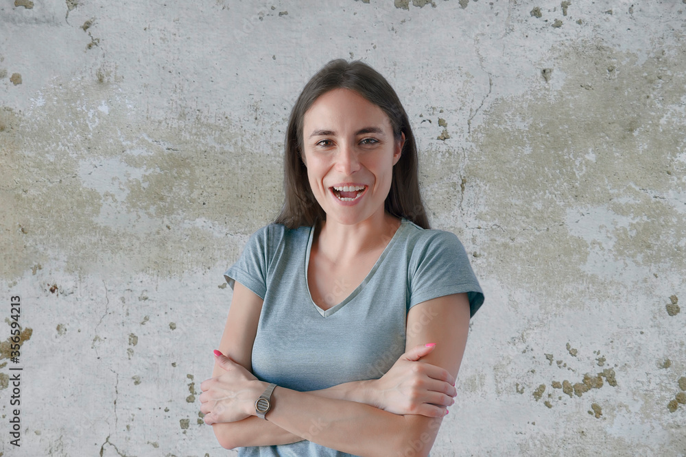 Portrait of smiling young woman with crossed arms Portrait of smiling young woman with crossed arms