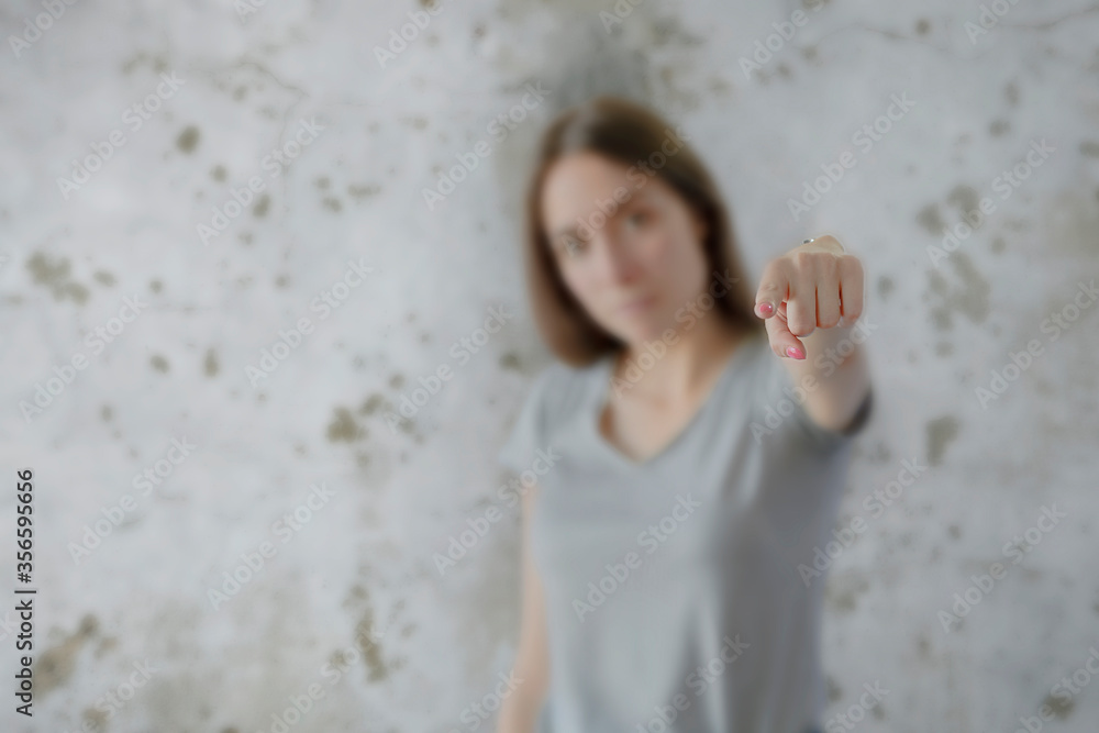 Young girl pointing finger and shouting at camera, emotional woman gesturing right at you Young girl pointing finger and shouting at camera, emotional woman gesturing right at you