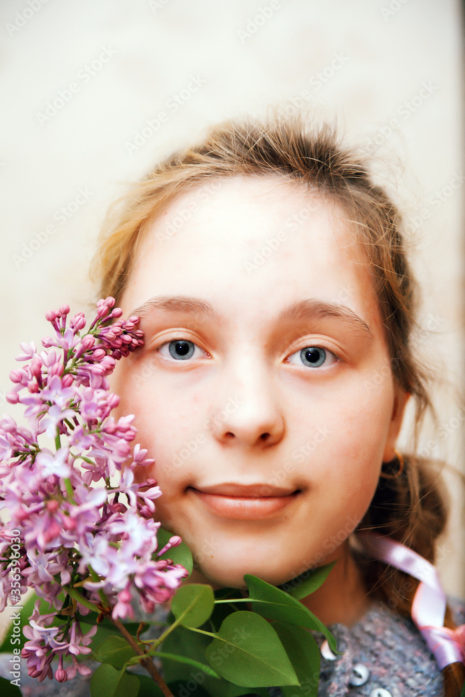 Teenage girl with lilac flowers. Teenage girl with lilac flowers.