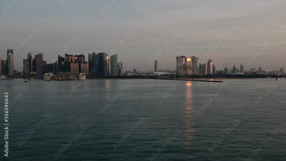 Singapore, city view from the sea. Financial district, office buildings, marina, city architecture, towers. Singapore, city view from the sea. Financial district, office buildings, marina, city architecture, towers.