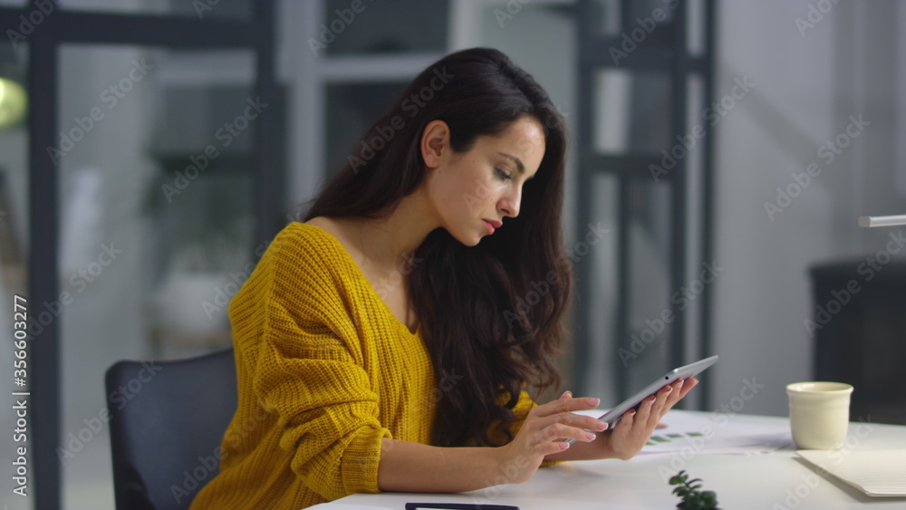 Businesswoman analyzing information on pad. Woman touching green screen on pad Businesswoman analyzing information on pad. Woman touching green screen on pad