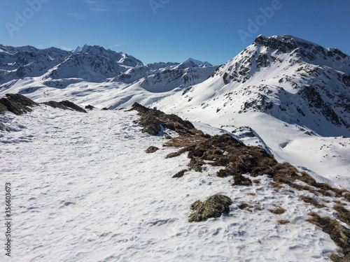 Panoramic view of the snow capped mountains of the Simplon pass in Switzerland.