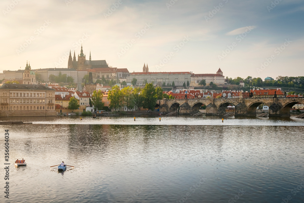 Evening view on Prague Castle with Charles Bridge in evening sunlight