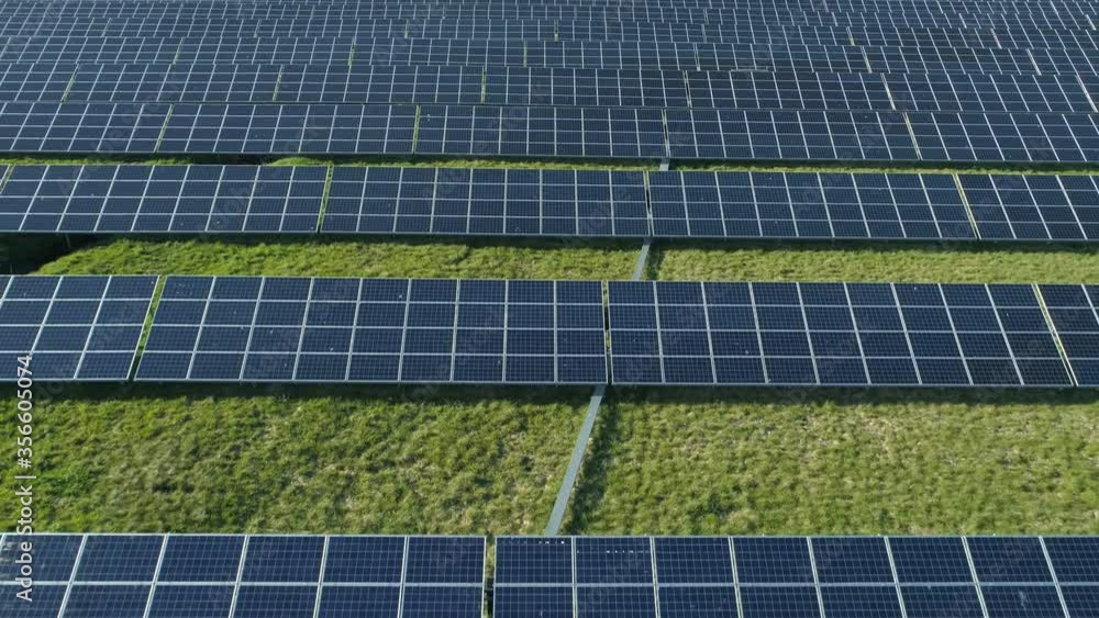 Solar panels producing renewable green electricity from sun energy aerial view Solar panels producing renewable green electricity from sun energy aerial view