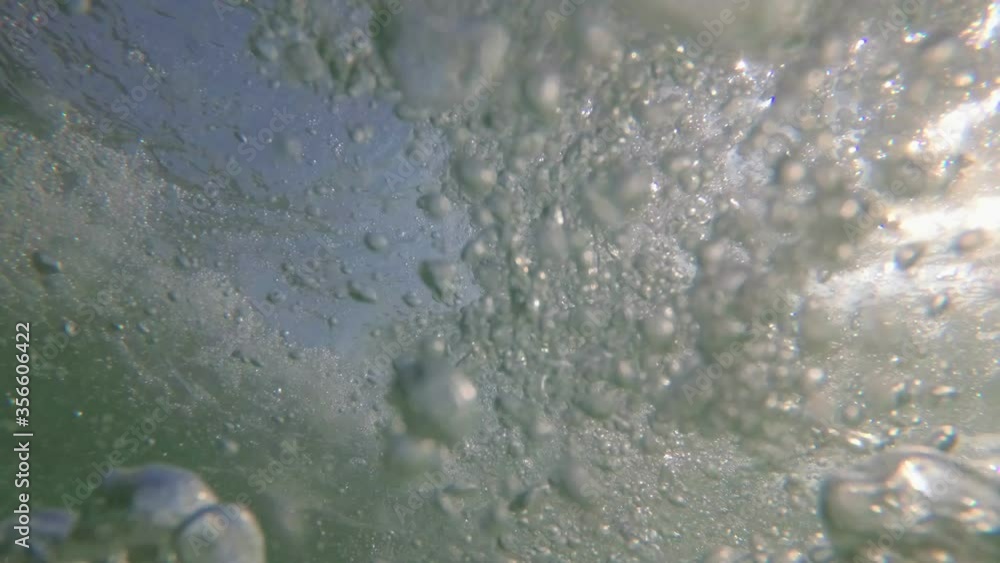 Beautiful underwater sea background. Bubbles of air in the sea rise up Beautiful underwater sea background. Bubbles of air in the sea rise up