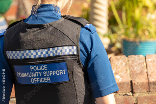 Rear Waist to Neck View of UK Female Police Community Support Officer (PCSO)