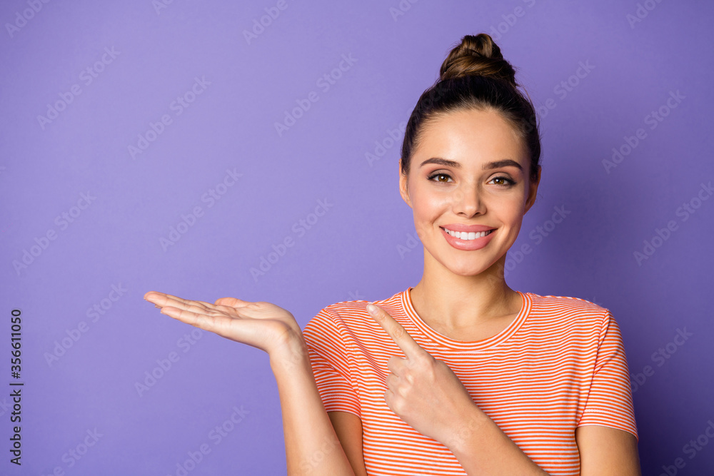 Close-up portrait of her she nice attractive cute fascinating content cheerful girl holding on palm demonstrating copy pace isolated on bright vivid shine vibrant lilac violet purple color background Close-up portrait of her she nice attractive cute fascinating content cheerful girl holding on palm demonstrating copy pace isolated on bright vivid shine vibrant lilac violet purple color background