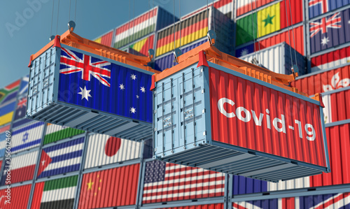 Container with Coronavirus Covid-19 text on the side and container with Australia Flag. Concept of international trade spreading the Corona virus. 3D Rendering © Marius Faust