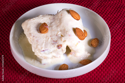 kulfi ice cream an indian delicacy falvoured with almonds and cashew photo