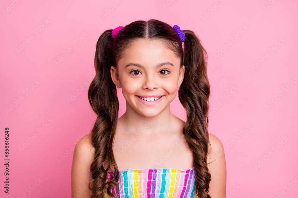 Closeup photo of beautiful little lady model with two lovely cute tails good mood wear casual colored rainbow dress summer singlet isolated pastel pink color background Closeup photo of beautiful little lady model with two lovely cute tails good mood wear casual colored rainbow dress summer singlet isolated pastel pink color background