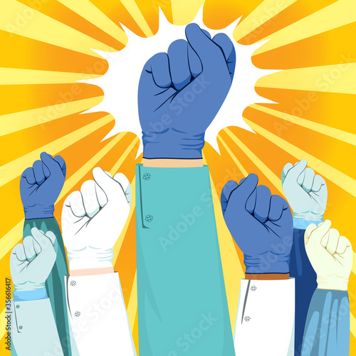 Beautiful young female nurse winking and raising fist up power concept