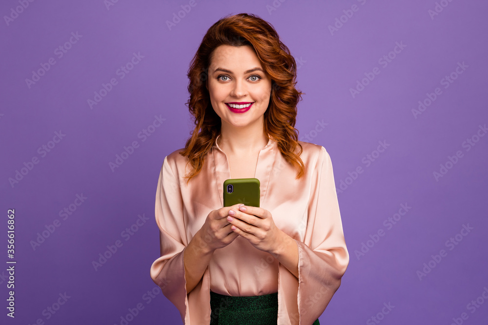 Photo of charming chic classy lady hold telephone hands toothy smiling got party invitation message good mood wear luxury beige shirt blouse isolated purple color background Photo of charming chic classy lady hold telephone hands toothy smiling got party invitation message good mood wear luxury beige shirt blouse isolated purple color background