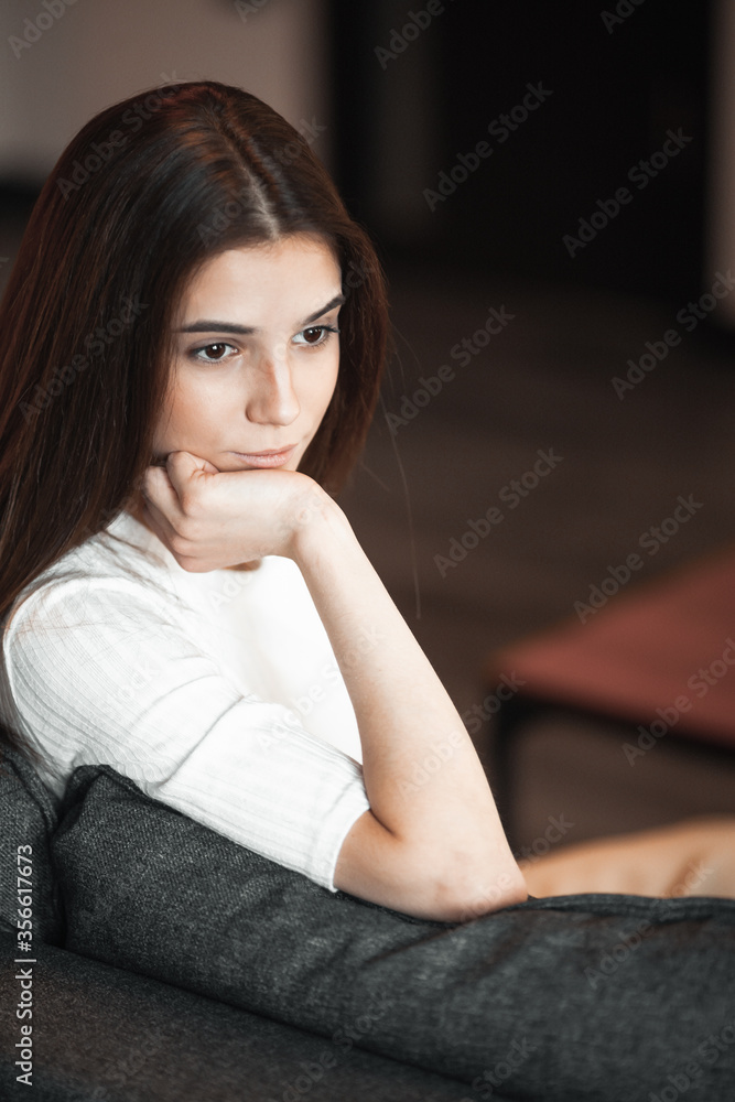 Young woman pretty relaxing on couch in living room Young woman pretty relaxing on couch in living room