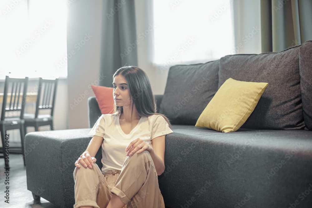 Young woman pretty relaxing on couch in living room Young woman pretty relaxing on couch in living room