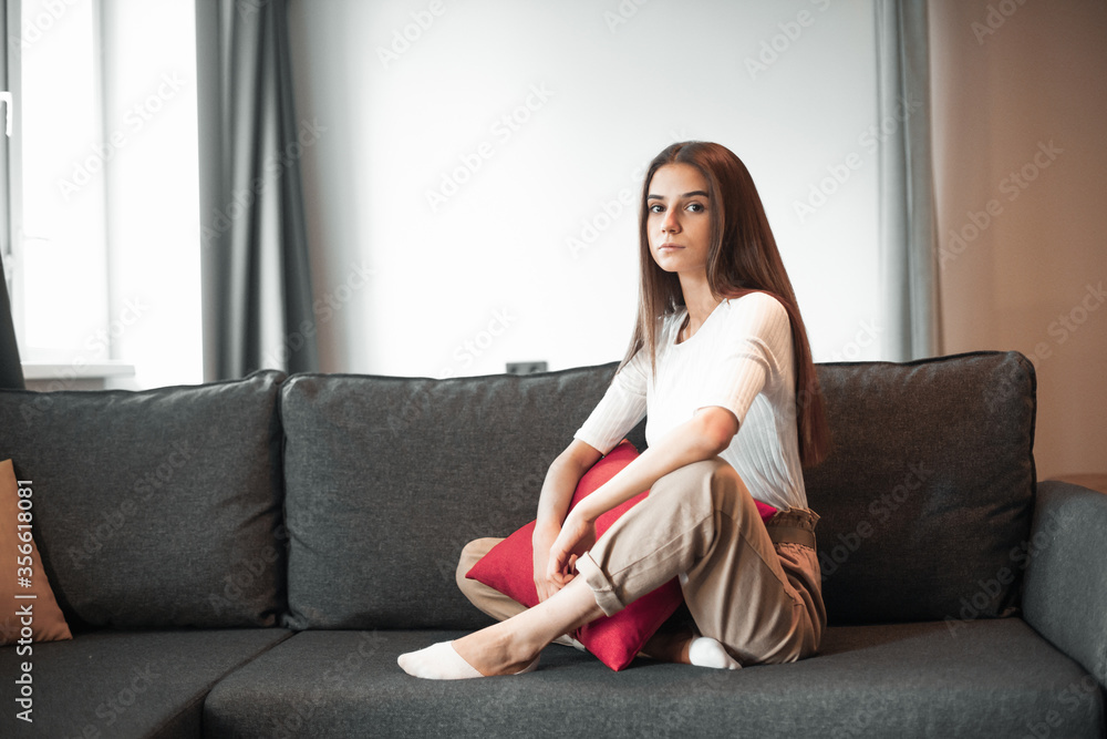 Fototapeta premium Young woman pretty relaxing on couch in living room