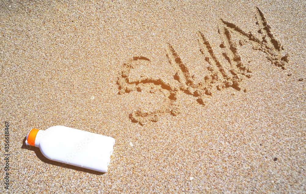 Bottle with sun protection cream on sand texture. Bottle with sun protection cream on sand texture.