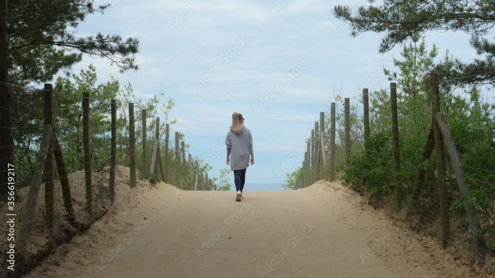 Woman Walking Towards Horizon Woman Walking Towards Horizon