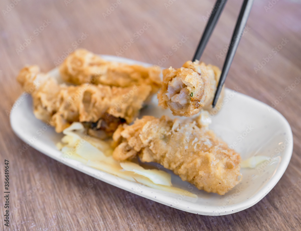 Fried shrimp roll - Taiwanese food cuisine in Tainan, Taiwan restaurant, close up, lifestyle.
Fried shrimp roll - Taiwanese food cuisine in Tainan, Taiwan restaurant, close up, lifestyle.