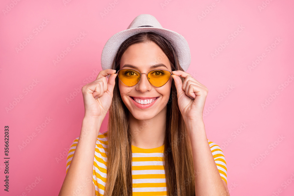 Close-up portrait of her she nice-looking attractive lovely pretty winsome content cheerful cheery girl touching specs isolated over pink pastel color background Close-up portrait of her she nice-looking attractive lovely pretty winsome content cheerful cheery girl touching specs isolated over pink pastel color background