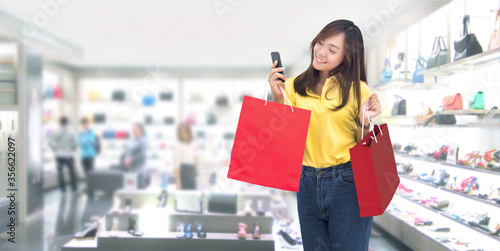 happy asian girl resive order in paper shopping bag