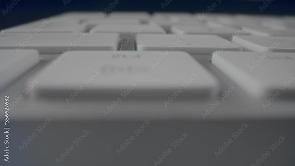 Macro of modern white keyboard of computer. White computer keyboard. Macro of modern white keyboard of computer. White computer keyboard.