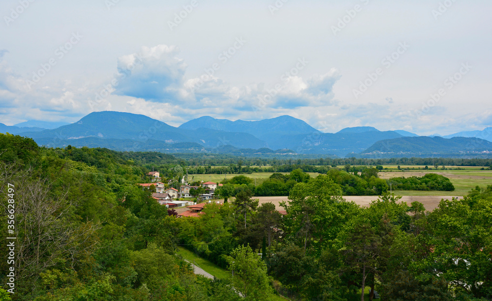 The landscape near Spilimbergo in the Udine province of N Italy, viewed from Terrazza Panoramica or panoramic terrace. Mountains can be seen-Monte Pala on the left,Monte Flagjel & Monte Cuar in centre