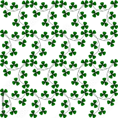 Small green Irish shamrocks on white for Saint Patrick s Day . Seamless repeating pattern for background or wallpaper.
