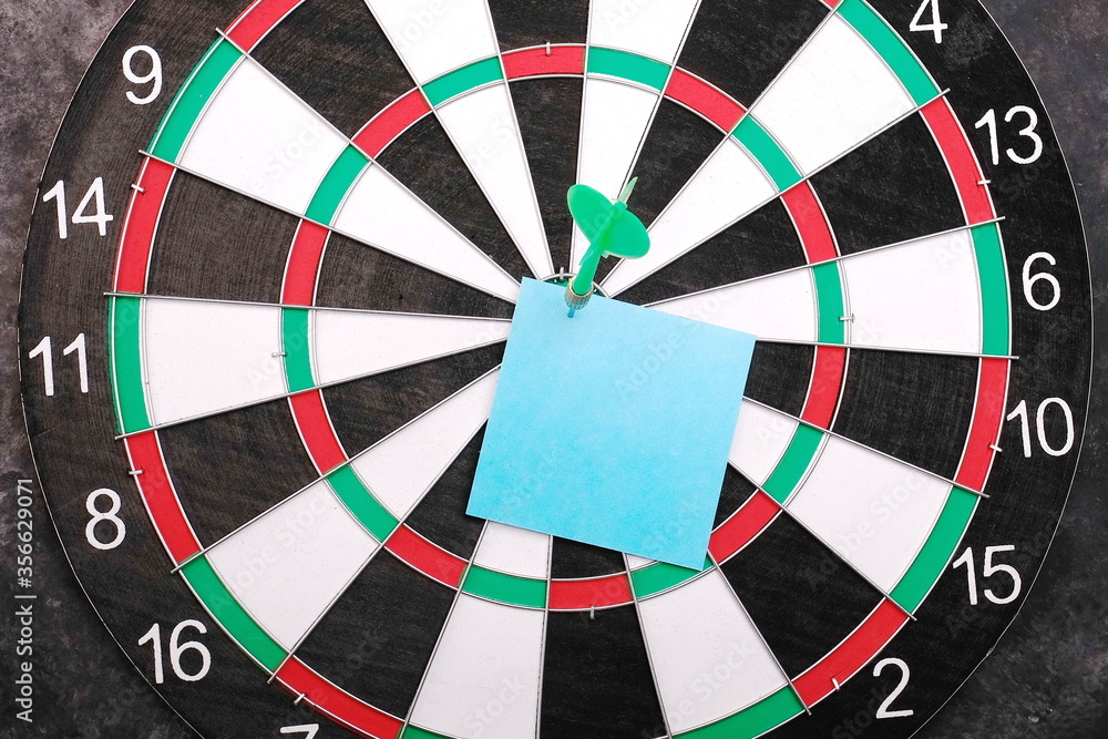 Darts and arrow. Hitting target, success business concept. Pinned paper Darts and arrow. Hitting target, success business concept. Pinned paper