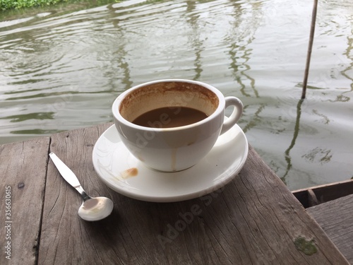 cup of coffee on wooden table