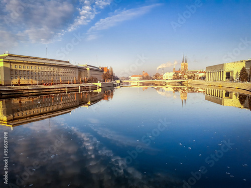 Wroclaw, Poland, January, 25, 2020, Oder river with Ostrow Tumski and Urzad Wojewodzki of Wroclaw. photo