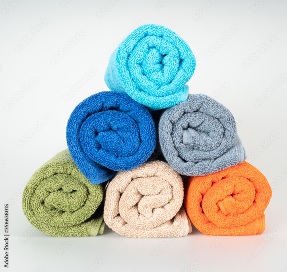 multicolored towels on a white background multicolored towels on a white background