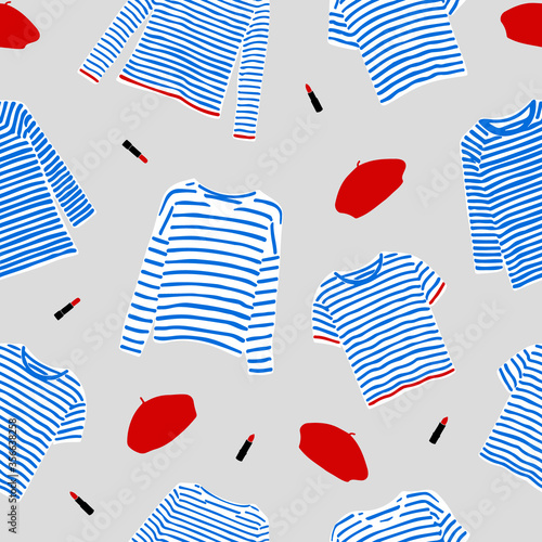 Seamless pattern with and drawn blue striped longsleeve t-shirts, red berets and lipsticks.