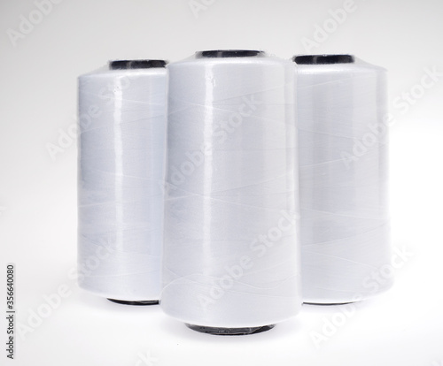 spools of thread on white background