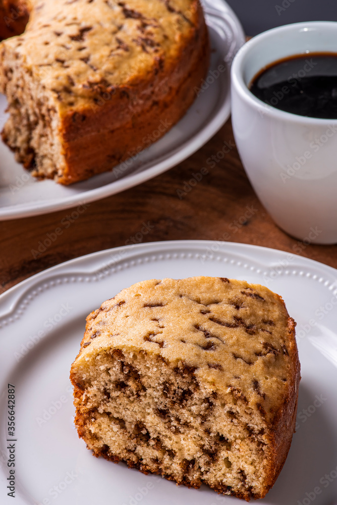 .Traditional Brazilian cake called Bolo Formigueiro. Vanilla cake with chocolate sprinkles. .Accompanied by a cup of coffee .Traditional Brazilian cake called Bolo Formigueiro. Vanilla cake with chocolate sprinkles. .Accompanied by a cup of coffee