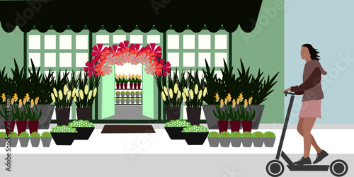 Girl with a push scooter in front of a flowershop