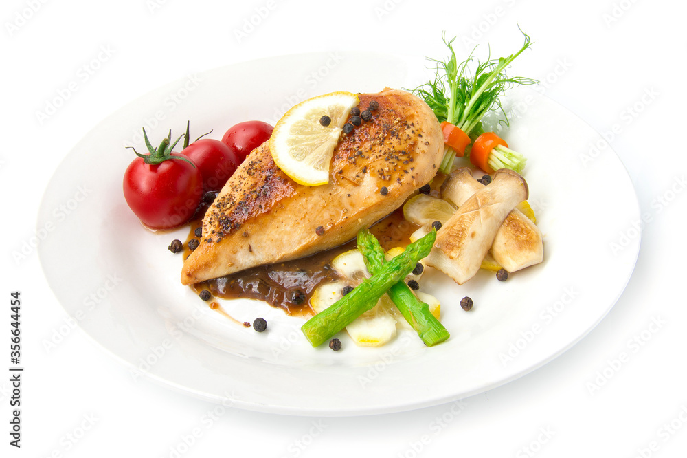 Grill Chicken breast or chicken steak with black peppers sauce topped black peppers decorate asparagus,oyster mushroom,tomato and lemon carved style side view isolated on white background Grill Chicken breast or chicken steak with black peppers sauce topped black peppers decorate asparagus,oyster mushroom,tomato and lemon carved style side view isolated on white background