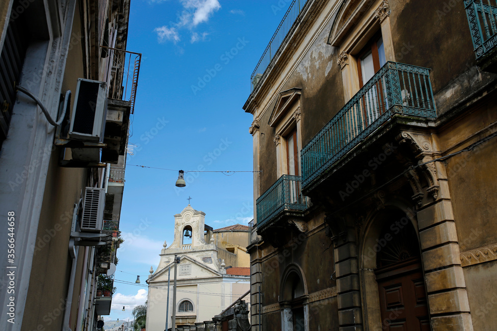 narrow street and church Chiesa dell'Addolorata in Riposto, Giarre, Sicily, Italy narrow street and church Chiesa dell'Addolorata in Riposto, Giarre, Sicily, Italy