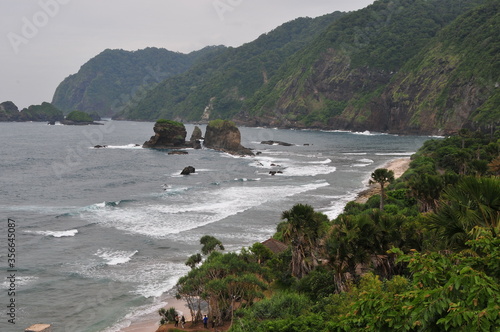 a fierce choppy beach on the south coast of Java, TANJUNGPAPUMA beach, located in the city of JEMBER, EAST JAVA, INDONESIA
 photo