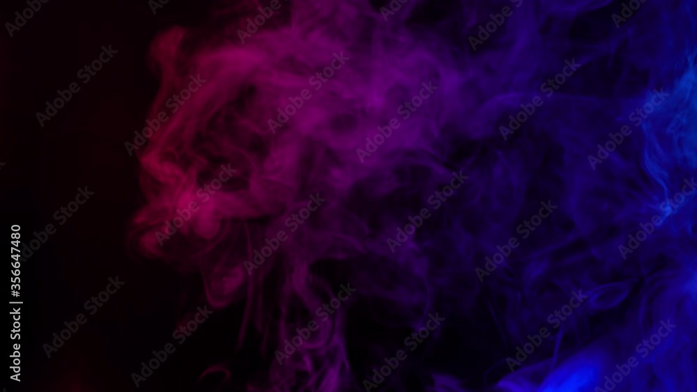 Smoke on a black background. Bright colorful smoke. Blue, raspberry, red, purple background. Beautiful abstract background. smoke texture. Pattern. Smoke on a black background. Bright colorful smoke. Blue, raspberry, red, purple background. Beautiful abstract background. smoke texture. Pattern.