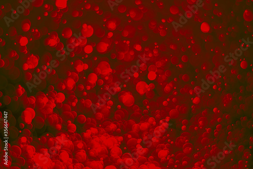 Red glitter vintage lights background. Red bokeh on black background.