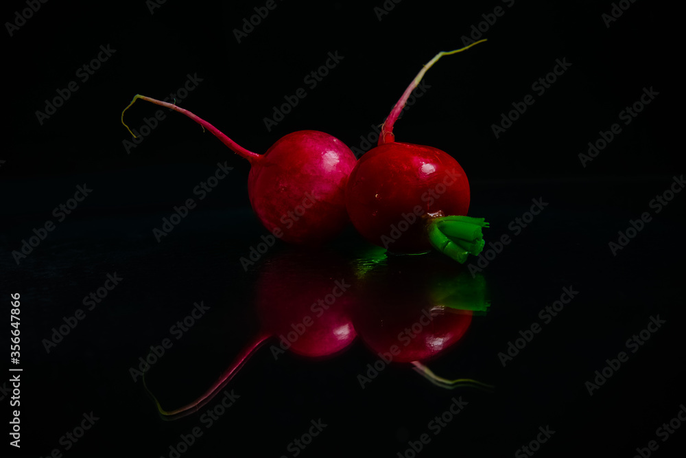 fresh sweet pink radish isolated on black background fresh sweet pink radish isolated on black background