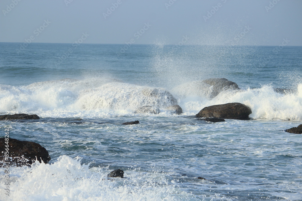 Sea Waves fighting between rocks at Indian Ocean