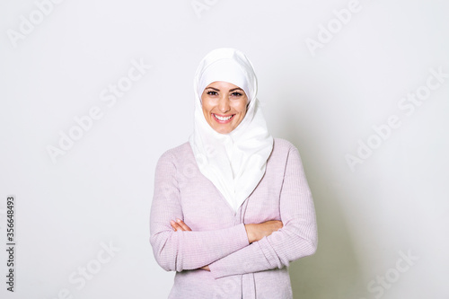 Photography Portrait of pretty young arab muslim woman in head scarf smile