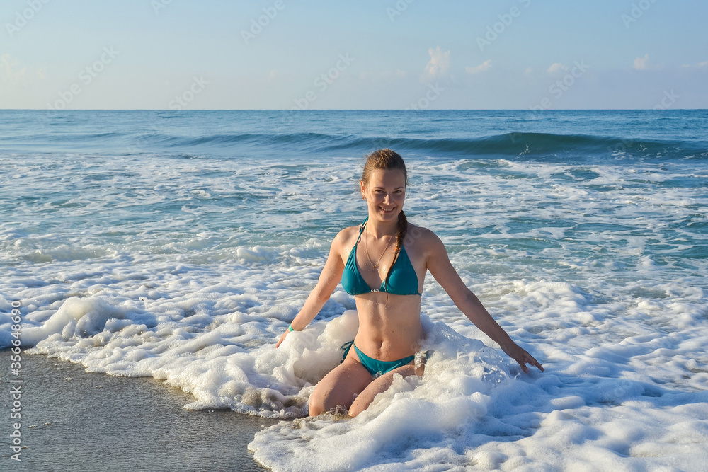 yong girl bathing in the sea in Turkey