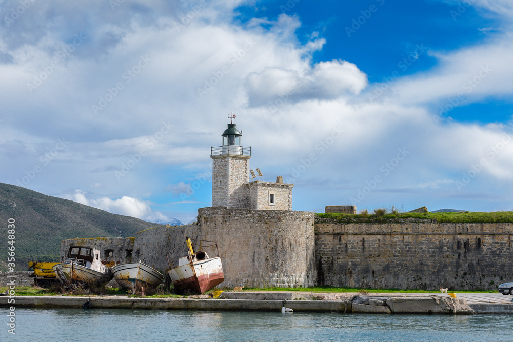 Santa Mavra castle in Lefkada island, Greece with a light house.