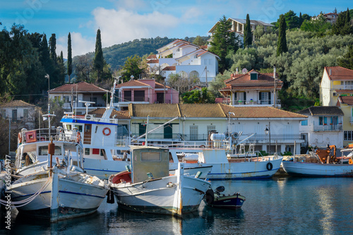The fishing village of Ligia on Lefkada island ,Greece with boats in the harbour. photo