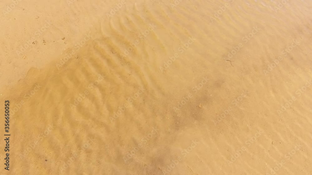 Waves of dirty sea and sand flushing on the shore. Waves of dirty sea and sand flushing on the shore.