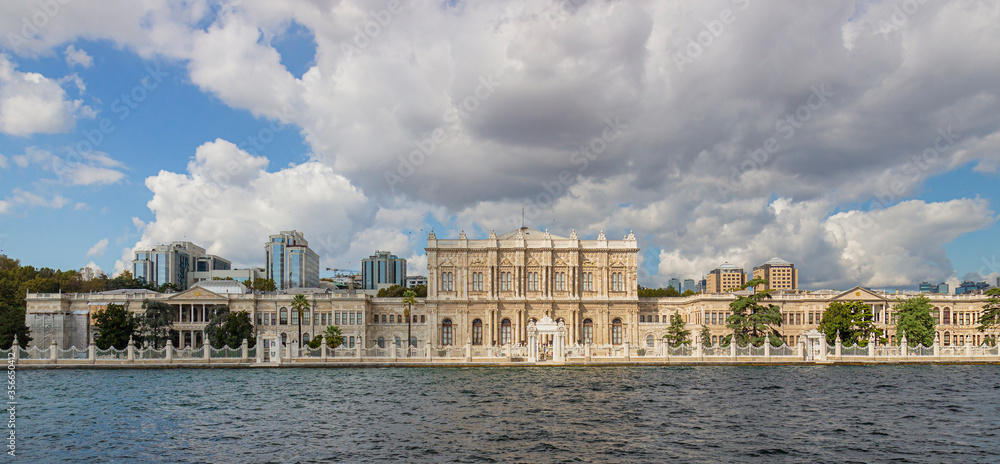Panoramic view from sea on Dolmabahce Palace located in the Besiktas district of Istanbul, Turkey, on the European coast of the Strait of Istanbul.