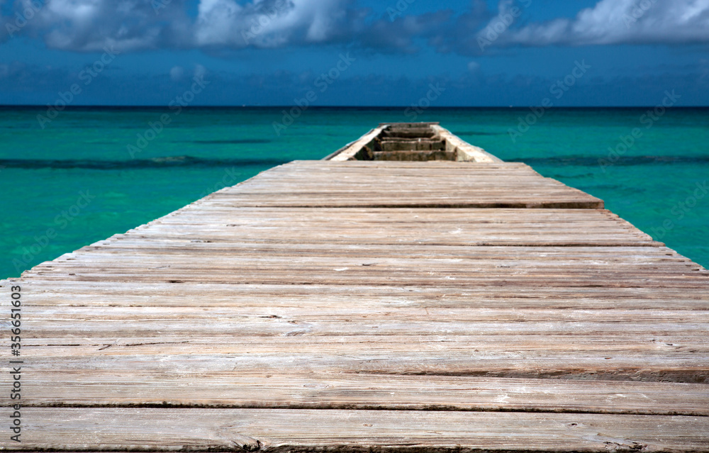 View from the pier and beautiful caribbean sea with blue sky. View from the pier and beautiful caribbean sea with blue sky.