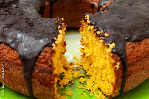 Wallpaper Mural Close-up of delicious and healthy traditional Brazilian homemade carrot cake with chocolate sauce. Background with crochet towel. Horizontal shot. Torontodigital.ca